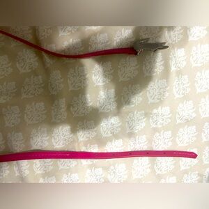 Women’s skinny Lacoste belt orange and pink